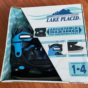 New never opened boys skates. Adjustable  Stainless steel blades and lined.